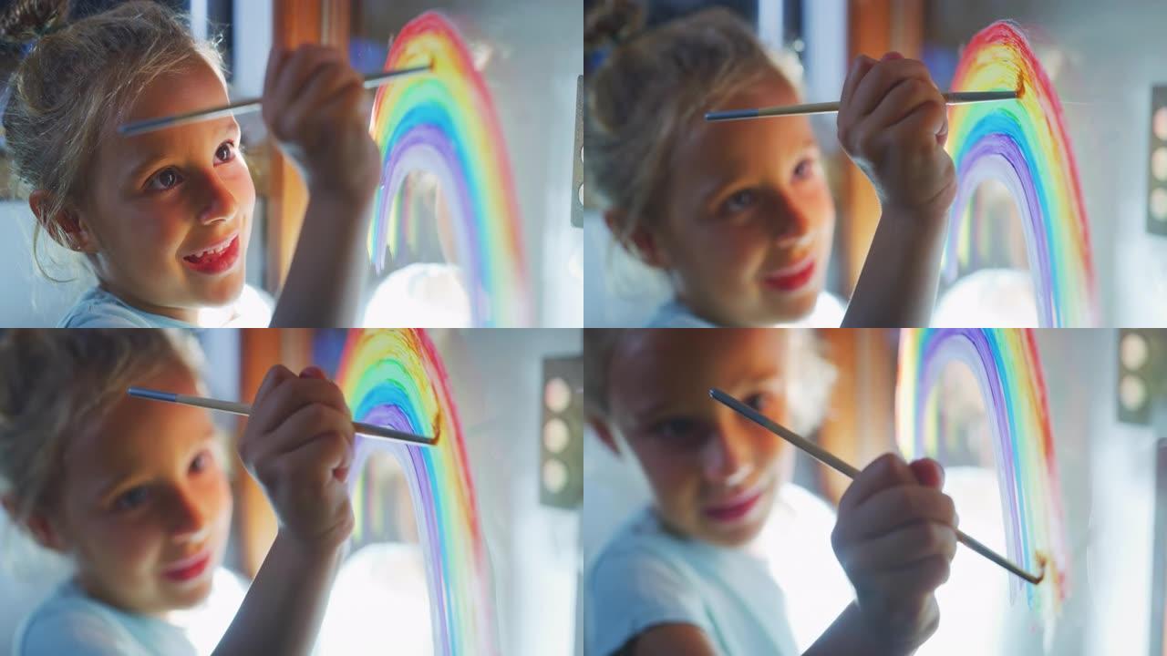 一个可爱的小创意快乐微笑的学龄前女孩画家的真实镜头正在家里厨房的窗户玻璃上画彩虹。