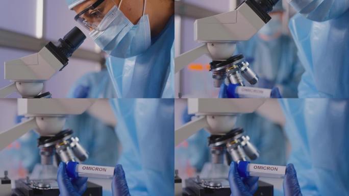 女实验室工作人员穿着个人防护用品，拿着标有Omicron标签的试管，分析样品