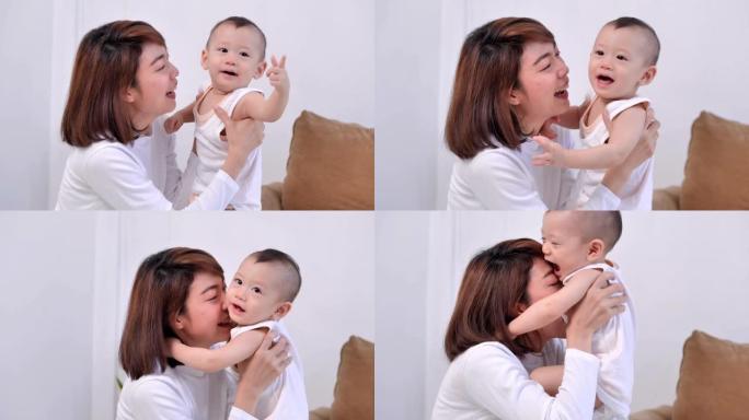 家庭的亚洲母亲和新生儿11个月，花时间一起在家里。快乐幸福的家庭。家庭关系。居家预防新冠肺炎疫情。东