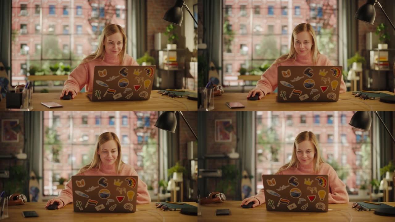 迷人的年轻女子坐在时尚舒适的创意办公室里，在笔记本电脑上工作。自由职业者在家远程工作。浏览互联网，使