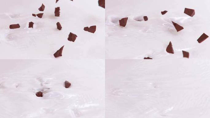 在4k超慢动作中飞溅成液体奶油的巧克力碎片