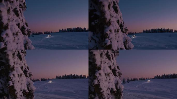 黄昏时在滑雪坡上的SLO MO雪犁卡车