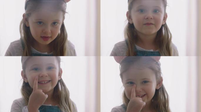 肖像快乐的小女孩微笑着带着顽皮的表情看起来快乐的孩子享受童年4k镜头