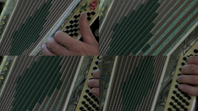 阿根廷一名男子弹奏钢琴手风琴的特写镜头。