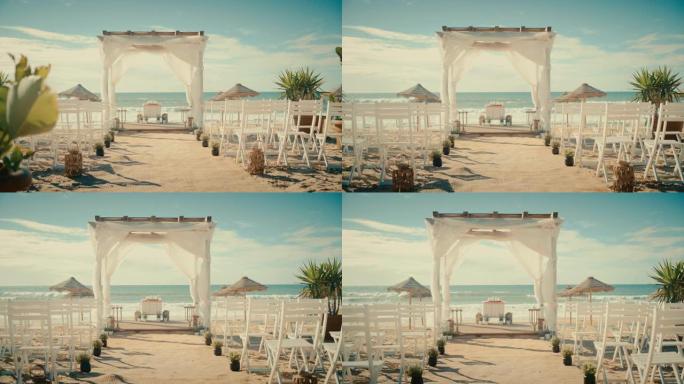 空荡荡的户外婚礼场地，配有椅子，可在靠近大海或海洋的海滩上举行正式仪式。一切都为美丽浪漫的婚姻庆典做