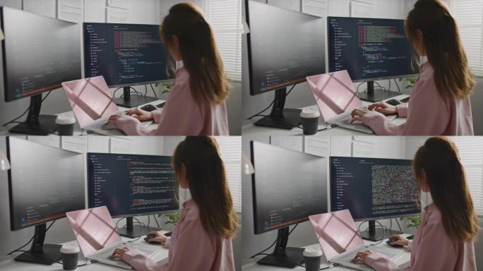 年轻的女商人移动开发人员在计算机上编写程序代码，
