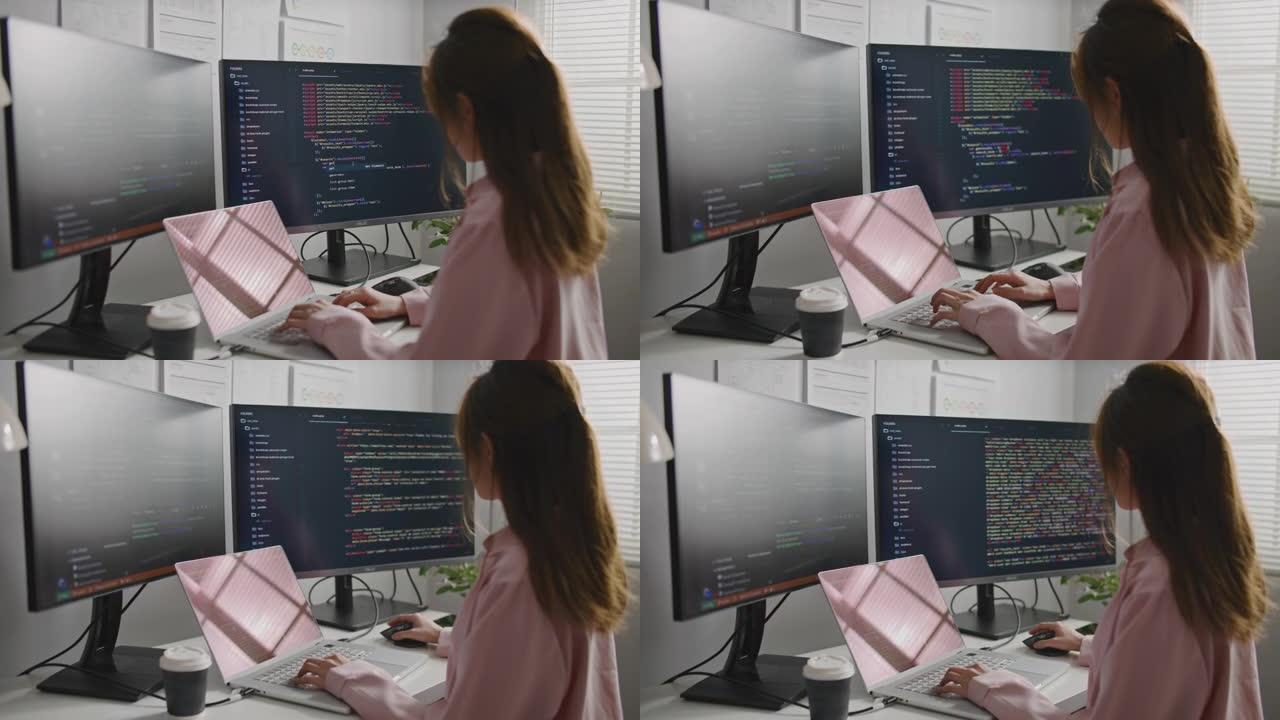 年轻的女商人移动开发人员在计算机上编写程序代码，