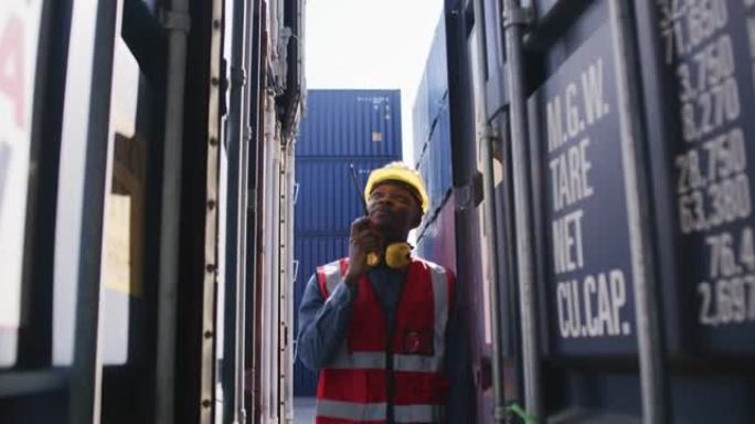 黑人非洲工人步行检查货物集装箱