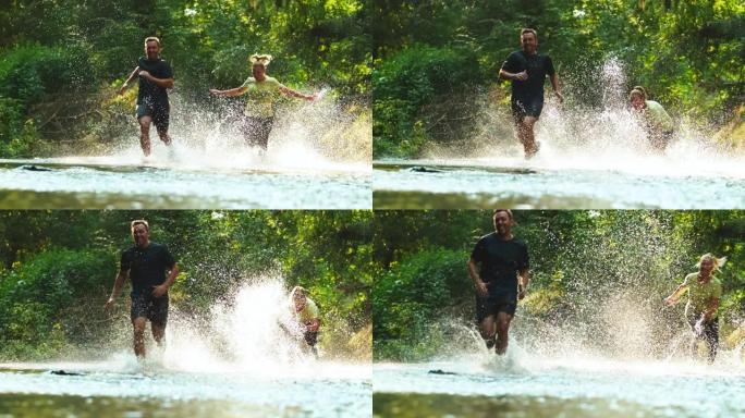 超级SLO MO夫妇在森林里跑过小溪时玩得开心