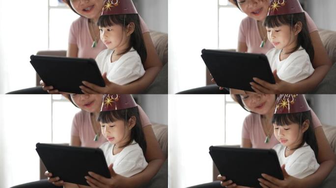 女儿在家中在数字平板电脑上进行视频通话