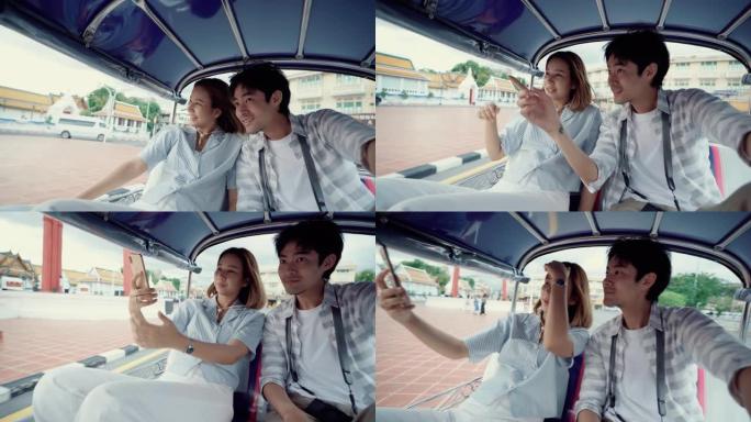 年轻的美女和男友穿着传统的泰国巴士