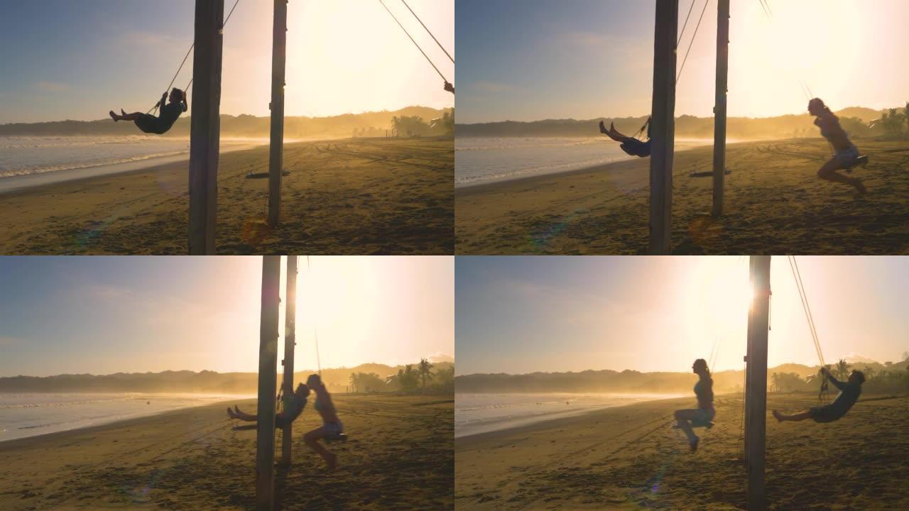 移动镜头: 年轻夫妇在日落时在热带海滩上摇摆