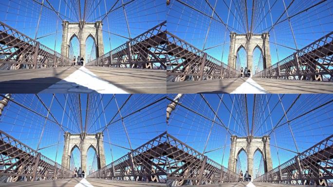 4K UHD倾斜: 游客行人在布鲁克林大桥上行走，背景为天际线。标志性地标和旅游目的地概念。