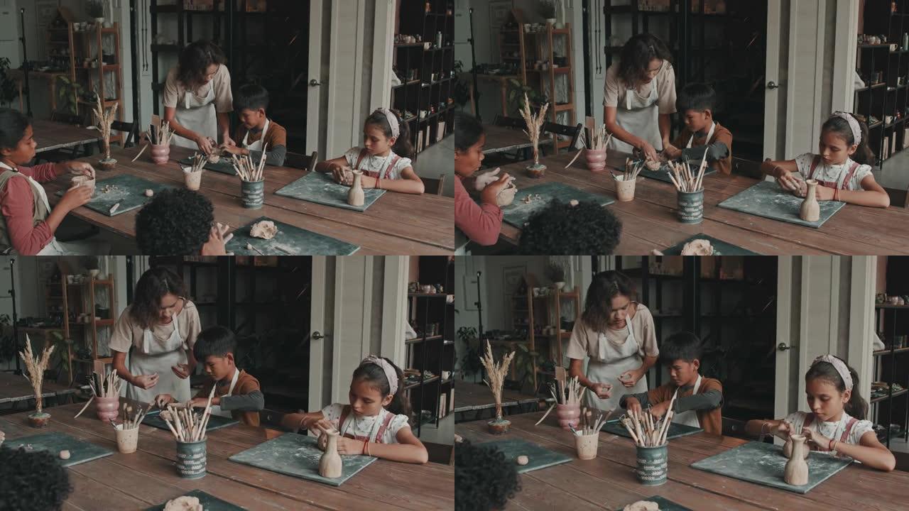教儿童陶器的妇女实拍视频素材宣传片