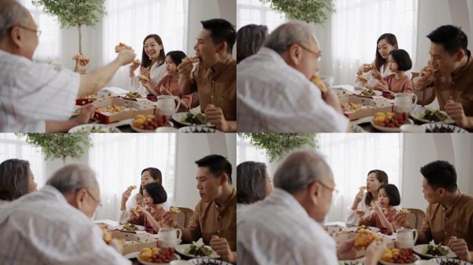 亚洲家庭在家里一起享用午餐