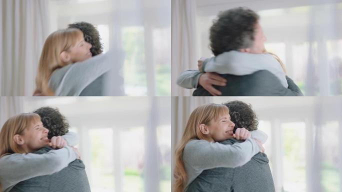 幸福的情侣拥抱兴奋的女人拥抱男朋友分享好消息享受在家浪漫关系4k镜头