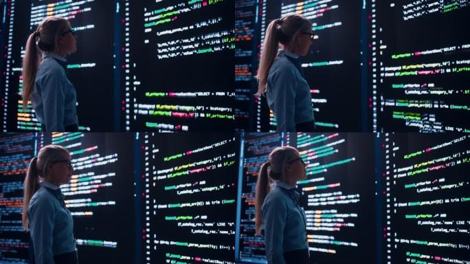 高科技创业概念: 创新的女软件工程师站在墙上做大数据分析，显示机器代码。用机器学习开发未来的电子商务