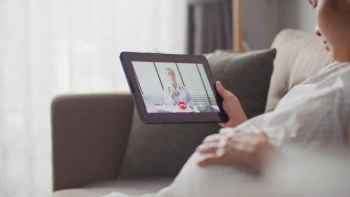 孕妇用数字平板电脑视频呼叫医生，远程医疗