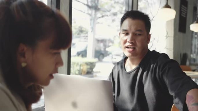 亚洲商人在咖啡馆聚会