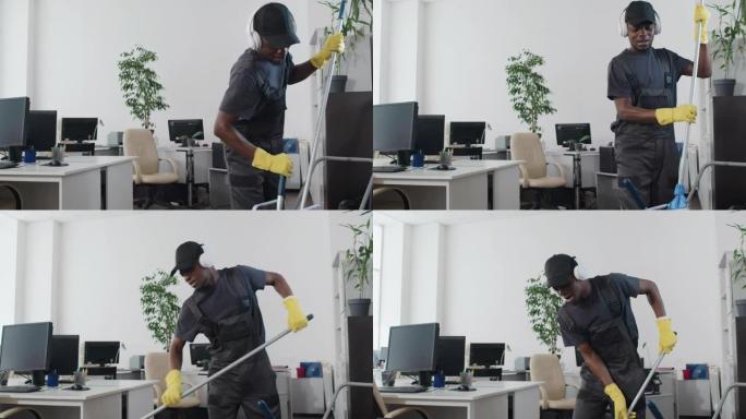 耳机清洁办公室里的快乐男人
