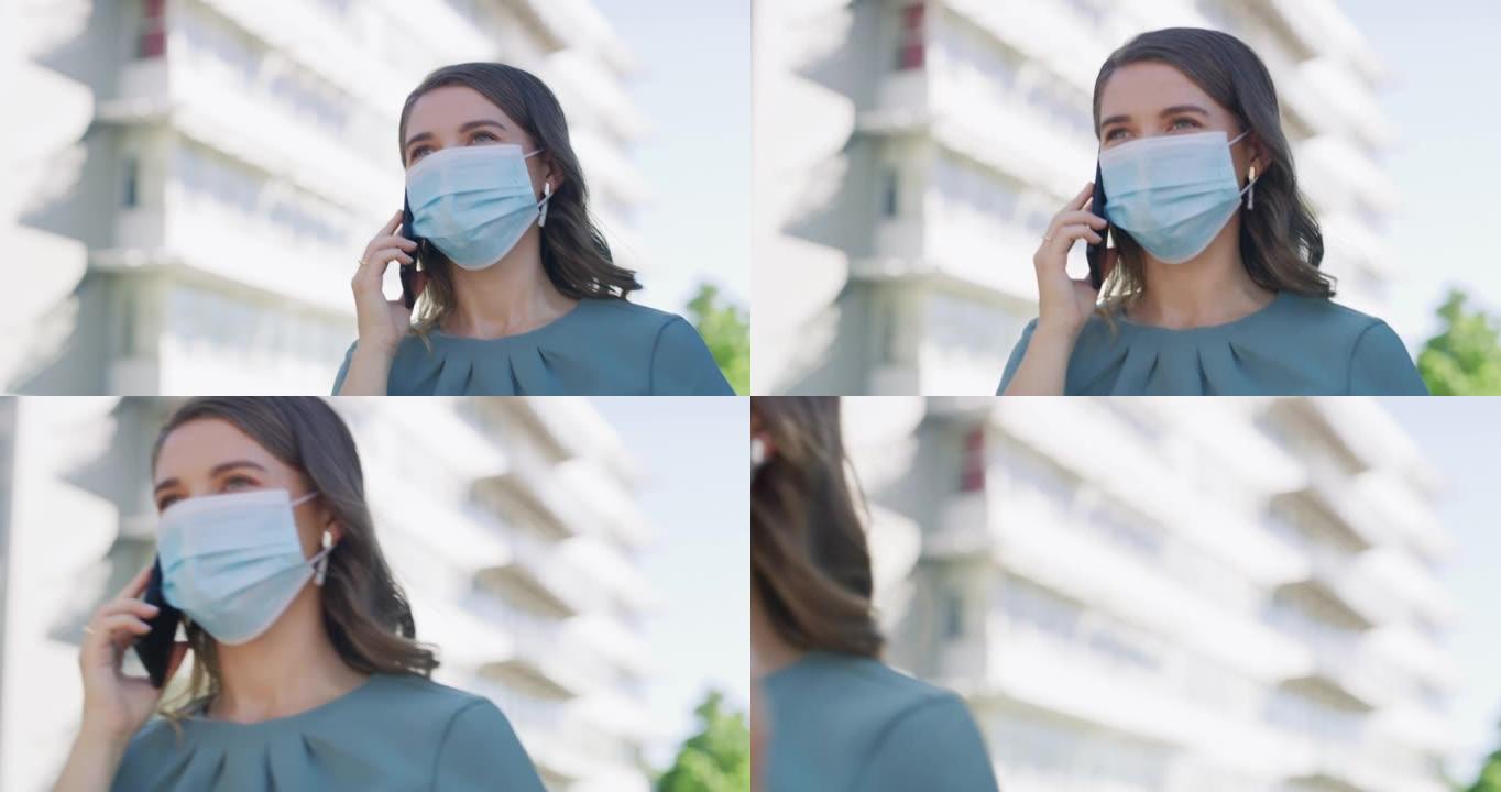 4k视频片段，一名年轻的女商人戴着口罩并在城市使用智能手机