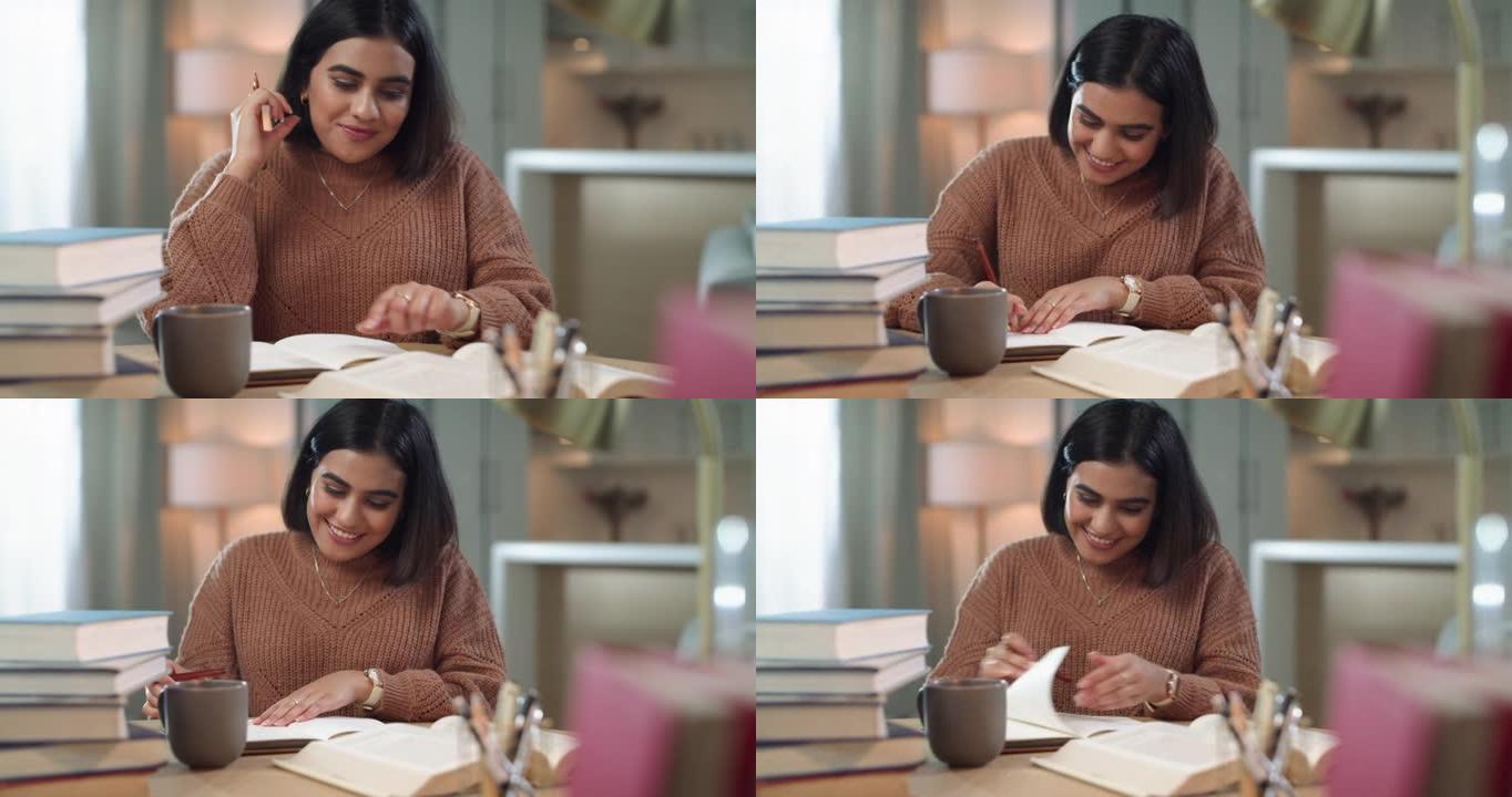 4k视频片段，一个迷人的年轻女子坐着，在笔记本上写笔记时感觉很出色