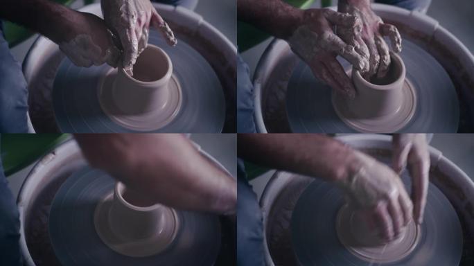 农作物陶艺家在纺车上制造锅