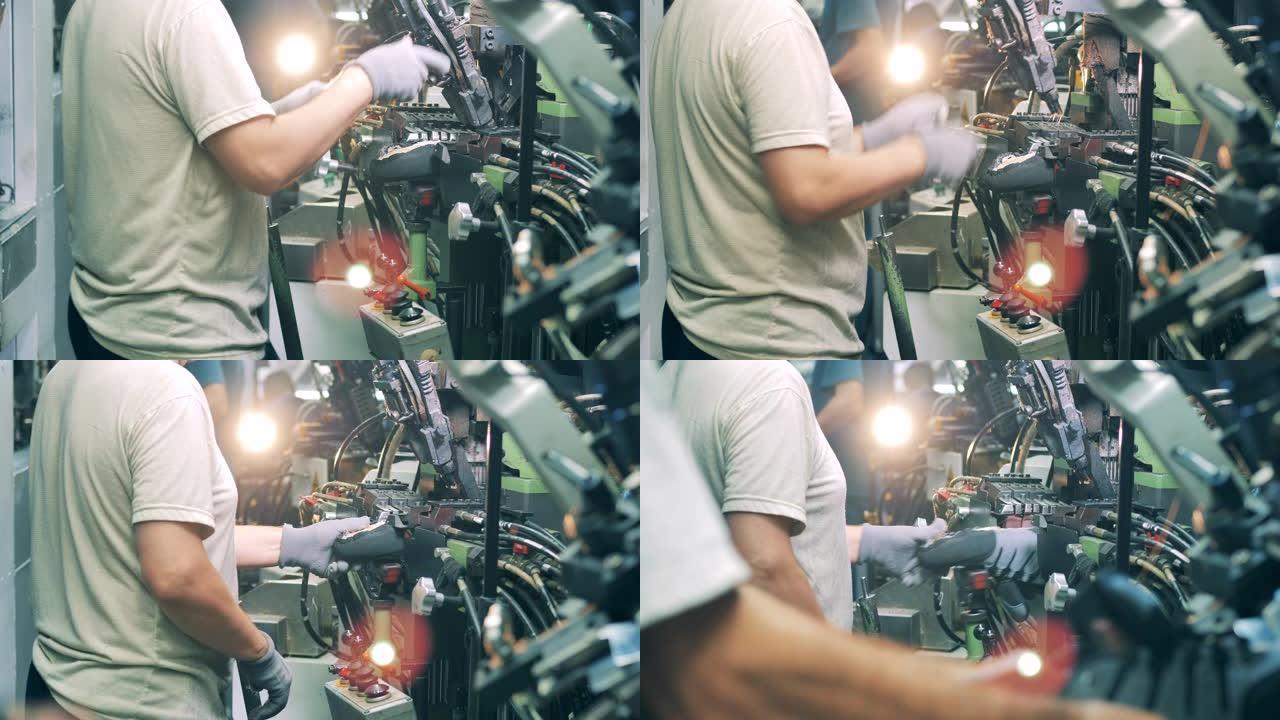 工厂工人正在用工业机器缝制鞋子