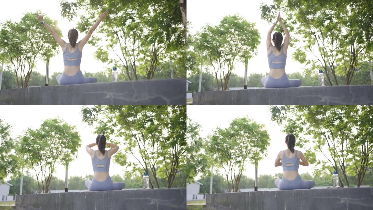 亚洲女性在家室内伸展瑜伽运动