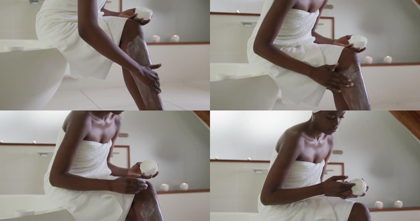 非裔美国迷人女性在浴室涂抹润唇膏