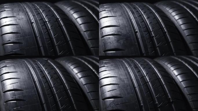 汽车轮胎纺纱的特写工作室拍摄 -- 全新街道轮胎上的胎面花纹