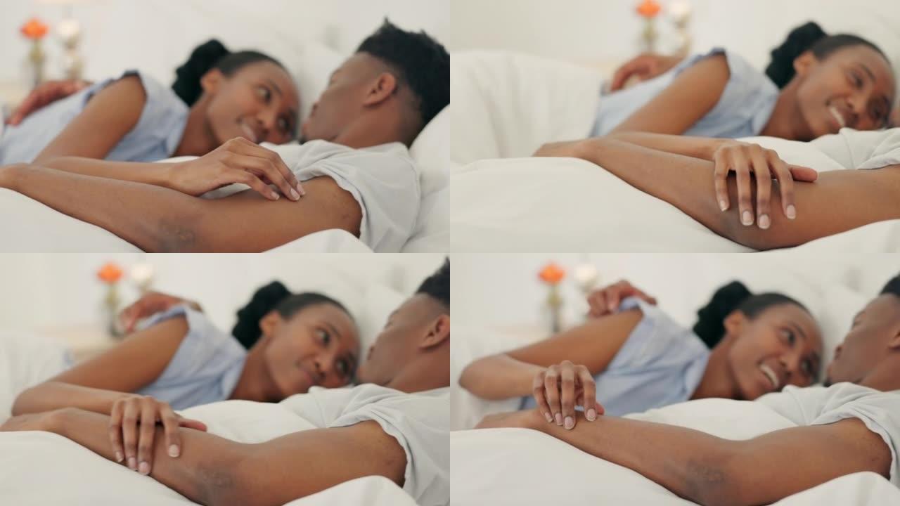 爱情，幸福和夫妻在睡觉后的早晨一起在床上聊天和休息。黑人男女在卧室的亲密婚姻中享有健康的关系，幸福和