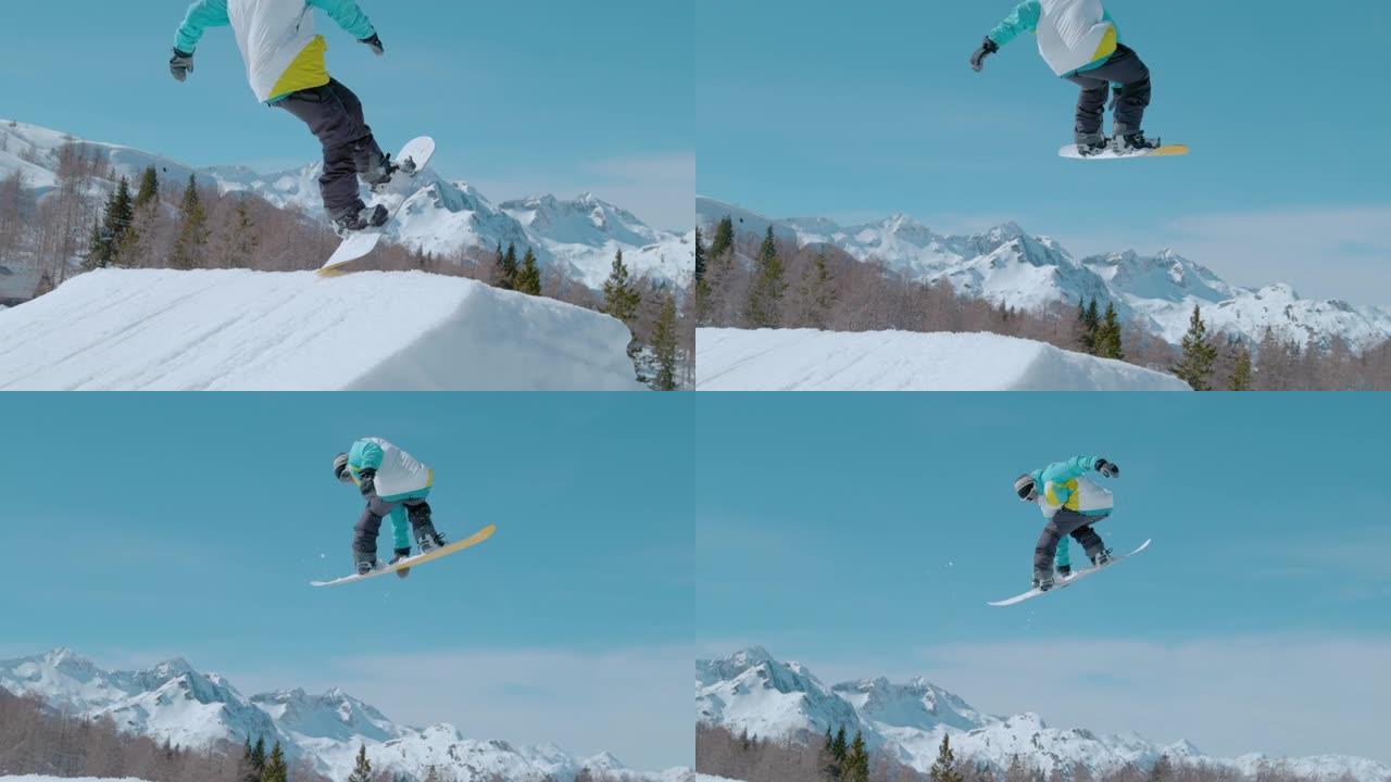 特写: 滑雪者在空中飞升，并进行旋转抓斗。