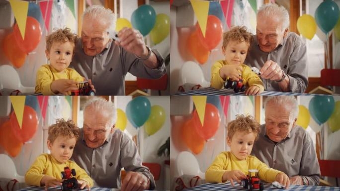 一个老人和他的孙子之间分享了令人心动的时刻: 快乐的蹒跚学步的孩子和他的爷爷在装饰有气球的厨房里一起