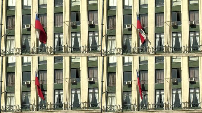 智利瓦尔帕莱索办公楼上的空调单元和智利国旗。