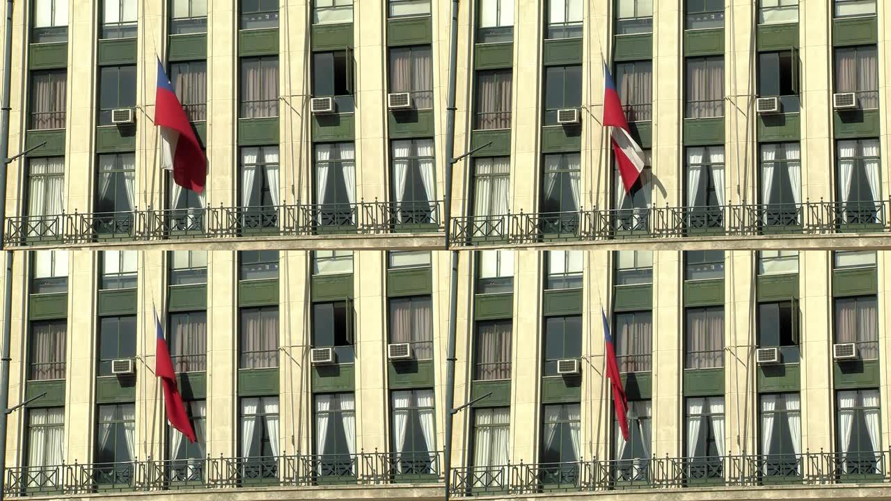 智利瓦尔帕莱索办公楼上的空调单元和智利国旗。