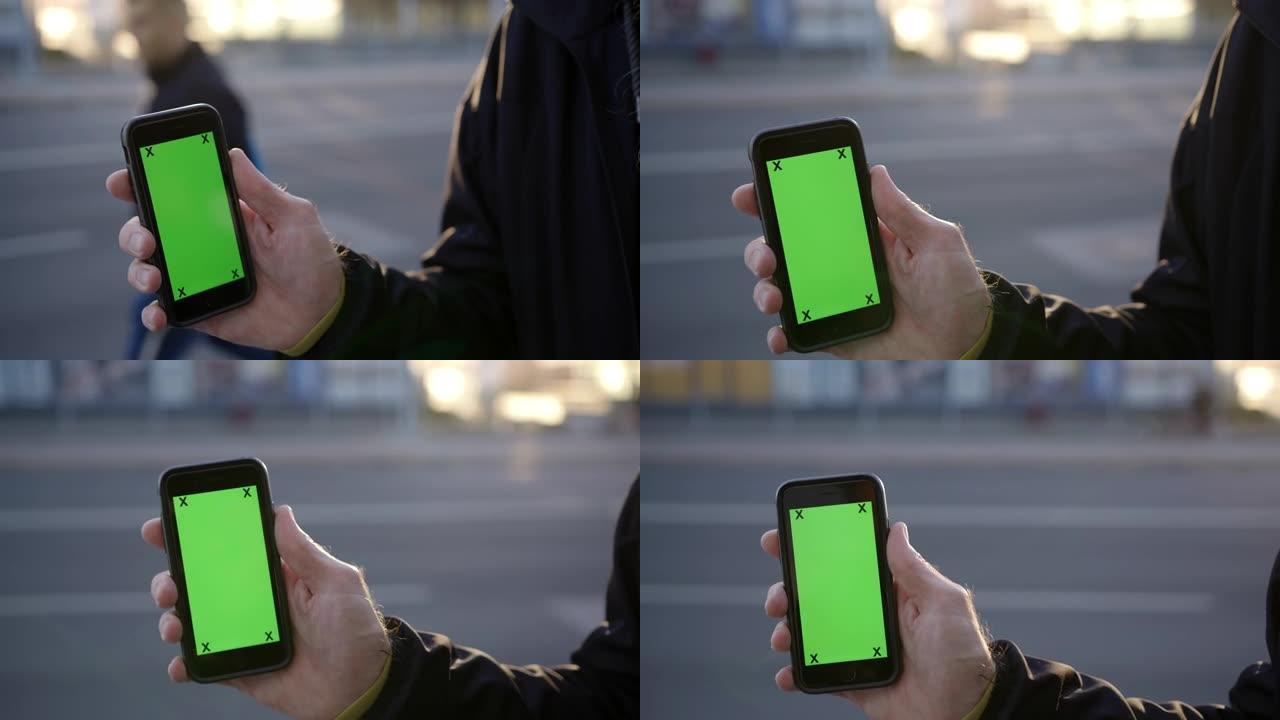 CU无法辨认的人手持绿屏智能手机