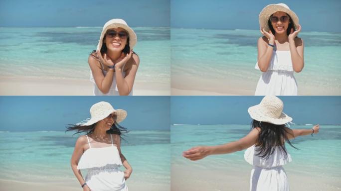 女人享受海滩假期沙滩美女笑脸清澈海水