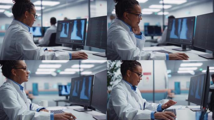 医院实验室: 黑人女医生正在计算机上分析胸部，骨骼的x射线在屏幕上。从事保健治疗研究的非裔美国专业医