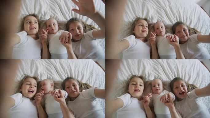 两个姐妹与新生兄弟玩耍的真实特写镜头