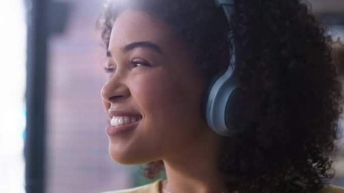 4k视频片段，一名年轻女子通过耳机听音乐