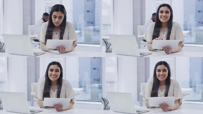 一名女商人坐在办公桌前使用数字平板电脑的4k视频片段
