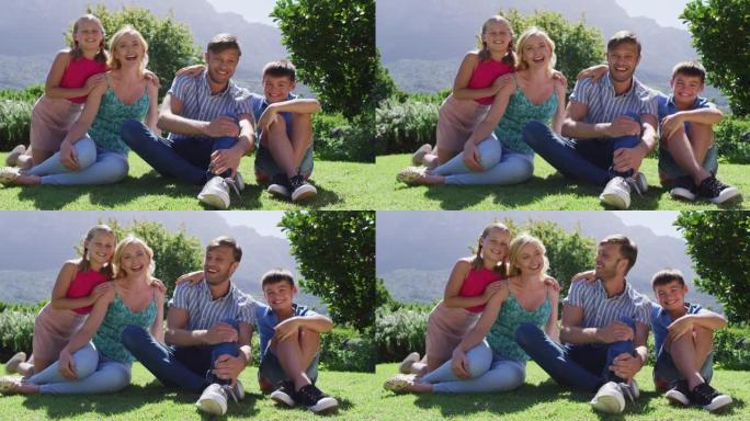 在晴朗的晴天坐在花园里时，高加索家庭一起微笑的肖像