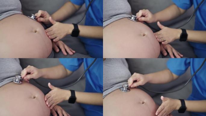 妇科医生使用听诊器检查孕妇的怀孕情况