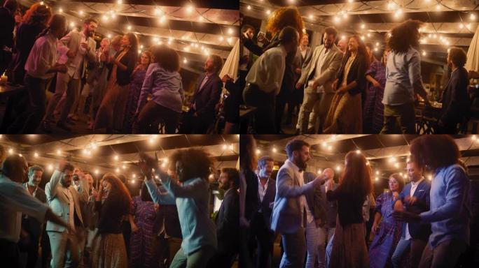 美丽的无忧无虑的朋友一起跳舞，并在聚会上庆祝晚间活动。多元化的多民族年轻人在餐厅的公司聚会上玩得开心