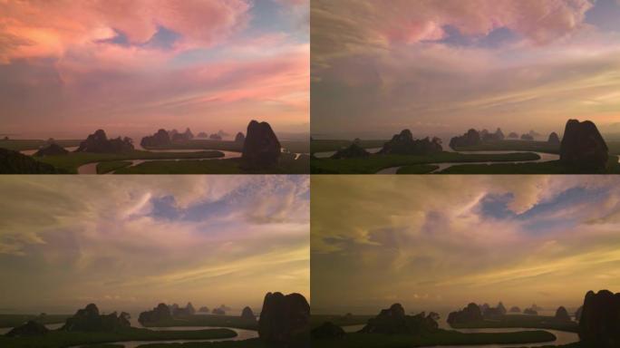 日落日天空和云中的热带岛屿的空中无人机视图。4k自然/野生动物/天气概念。