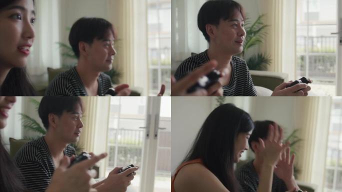 亚洲夫妇一起玩电子游戏很开心。