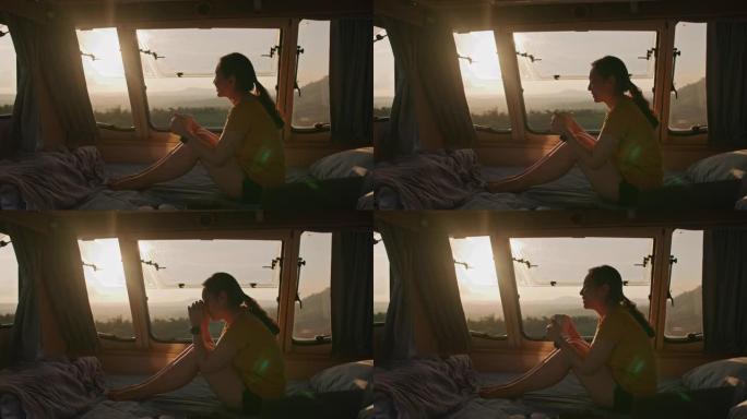 女人在汽车露营中欣赏日落美景