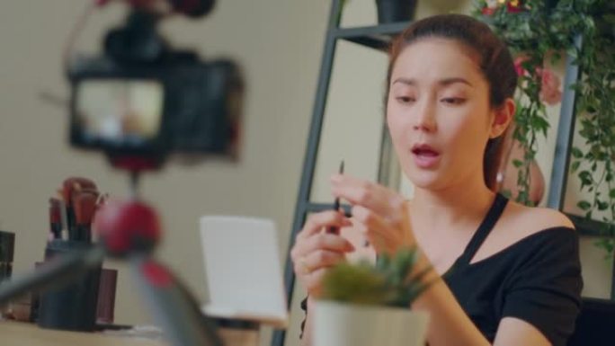 亚洲女性化妆视频记录器录制化妆技巧病毒内容。社交媒体概念
