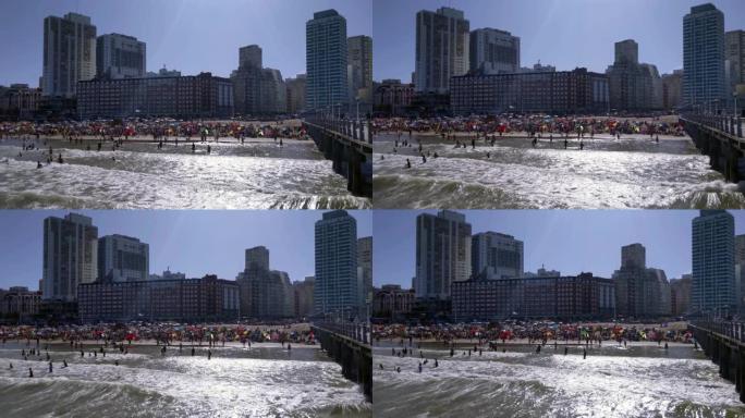 阿根廷布宜诺斯艾利斯省3月普拉塔市海滩上的游客。4k分辨率。